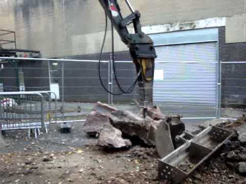 8 ton volvo breaking  up some concrete at Salford Uni, Manchester