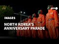 North Koreans Don Hazmat Suits For Anniversary Parade AFP