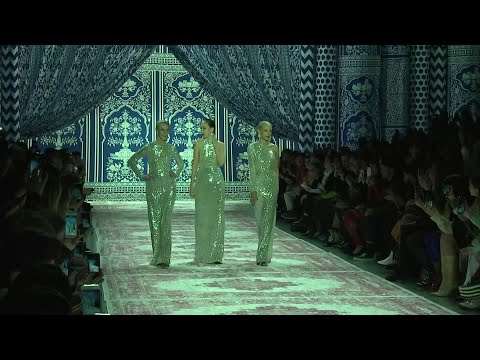 Naeem Khan has brought ‘70s glam back to the runway with the help of a few models of the time. The Halston icons Pat Cleveland, Karen Bjornson and Alva Chinn closed Khan’s fashion show in silver sequined evening gowns. Khan is known for his sparkling evening looks, but he got his start at Halston back in the day. (Feb. 12)