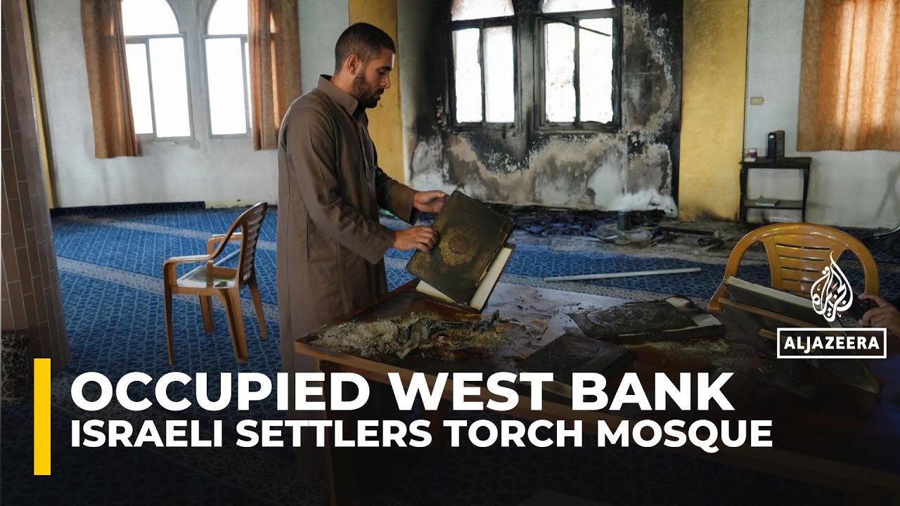 Israeli settlers torch and deface a mosque in a Palestinian village in the occupied West bank