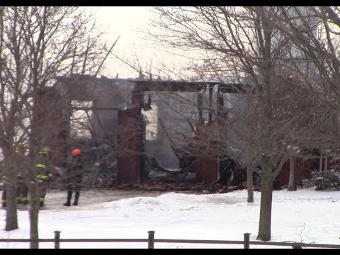 Firefighters brave blizzard like conditions to fight house fire