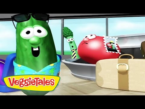 Animated VeggieTales scene with a green cucumber wearing sunglasses and a blue floral shirt, and a red tomato nearby, a broccoli stalk in the background, and a beige suitcase; VeggieTales logo in the corner.