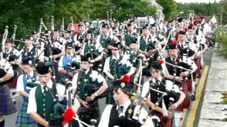 preview picture of video 'Massed Bands march across the bridge in Nethy Bridge at the end of the Highland Games 8 Aug 2009'
