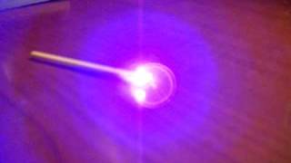 blue ray laser lighting a match