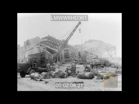 SEABEES IN NORMANDY,1) MS HUGE SCOOP SHOVEL DUMPING DEBRIS INTO TRUCK.2) MS BROKEN UP  - LMWWIIHD361