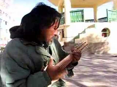 Uyuni homeless playing Charango