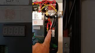 Review of Rheem RETEX 13 Tankless water heater and how to install, remove cover, and wire.