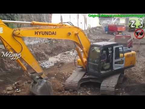 Excavator hyundai 210 robex loading debris toyota dyna dumpe...