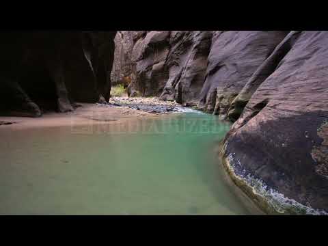 Stock Video - View of a teal pool in a river in Zion National Park