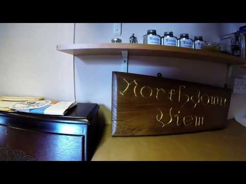 time lapse video of gold leaf gilding a hand made house sign