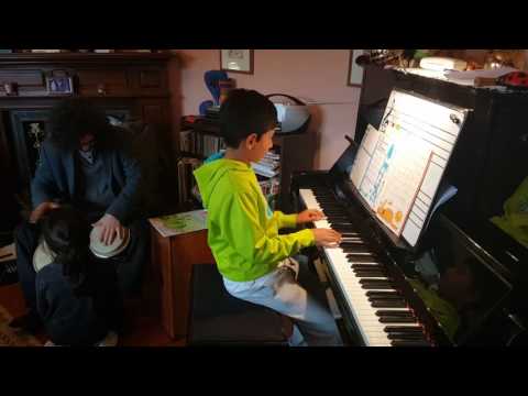 Father and son Kai grooving Latin style at the Piano Party today. Lots of fun and games!