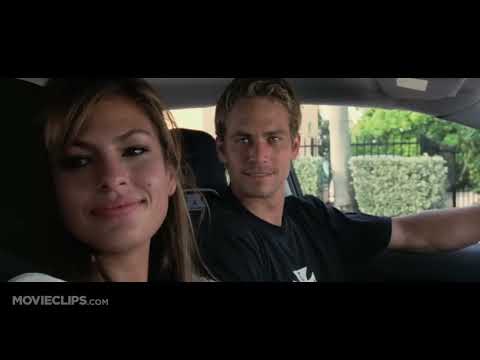 Official trailer still for 2 Fast 2 Furious: neon-lit Miami street with cars lined up to race