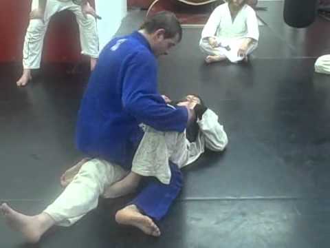 Brazilain Jiu Jitsu Black Belt Cane Prevost showing Posture in the Half Guard