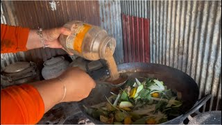 Poor woman cooking Khmer food