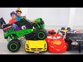 Vlad and Nikita ride on toy monster truck and goes through the cars for kids