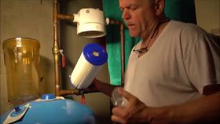 High-Flow Household water filter replacement process.