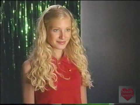 Disney Channel promo frame: Loretta Modern performs with the Zetta Bytes under neon lights