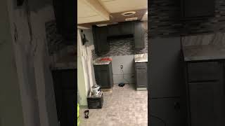 Complete install of cabinets and tiled backsplash 