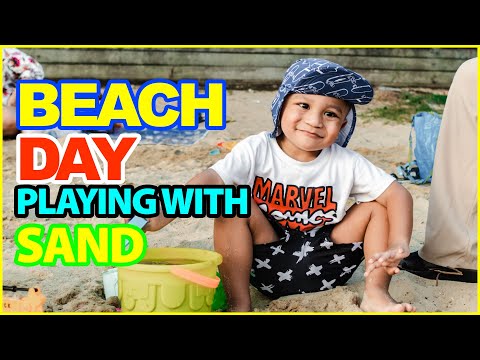 Zayd playing with Sand at the Beach
