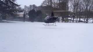 preview picture of video 'Two helicopters landing in snow at Bibury Court Hotel, Gloucestershire'