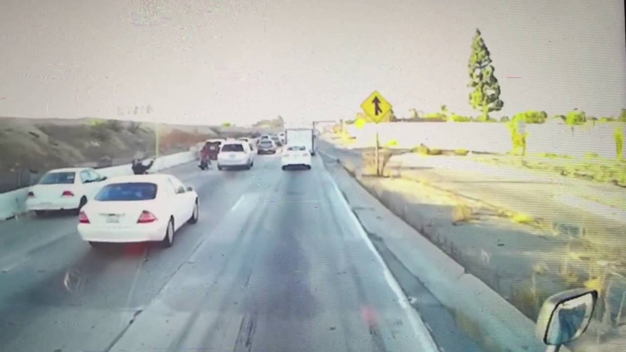 Video: Motorcyclist jumps on vehicle of hit and run driver