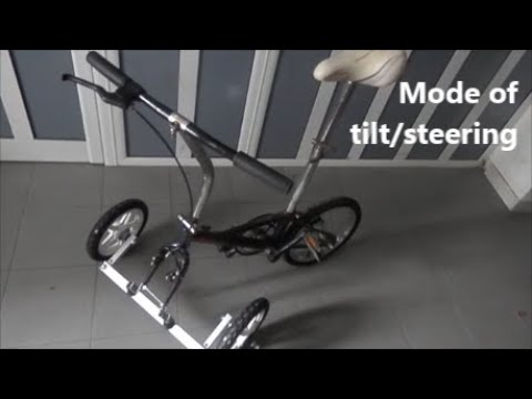 Folding tadpole trike with tilt steering mode preventing overturns by shifting trike body 22patented