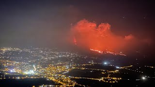 I experienced an earthquake while recording this video. The sky over the volcano is orange red.