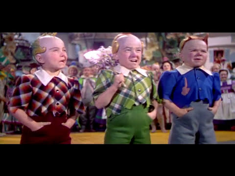 Emerald City parade imagery from the trailer button as choral textures soar