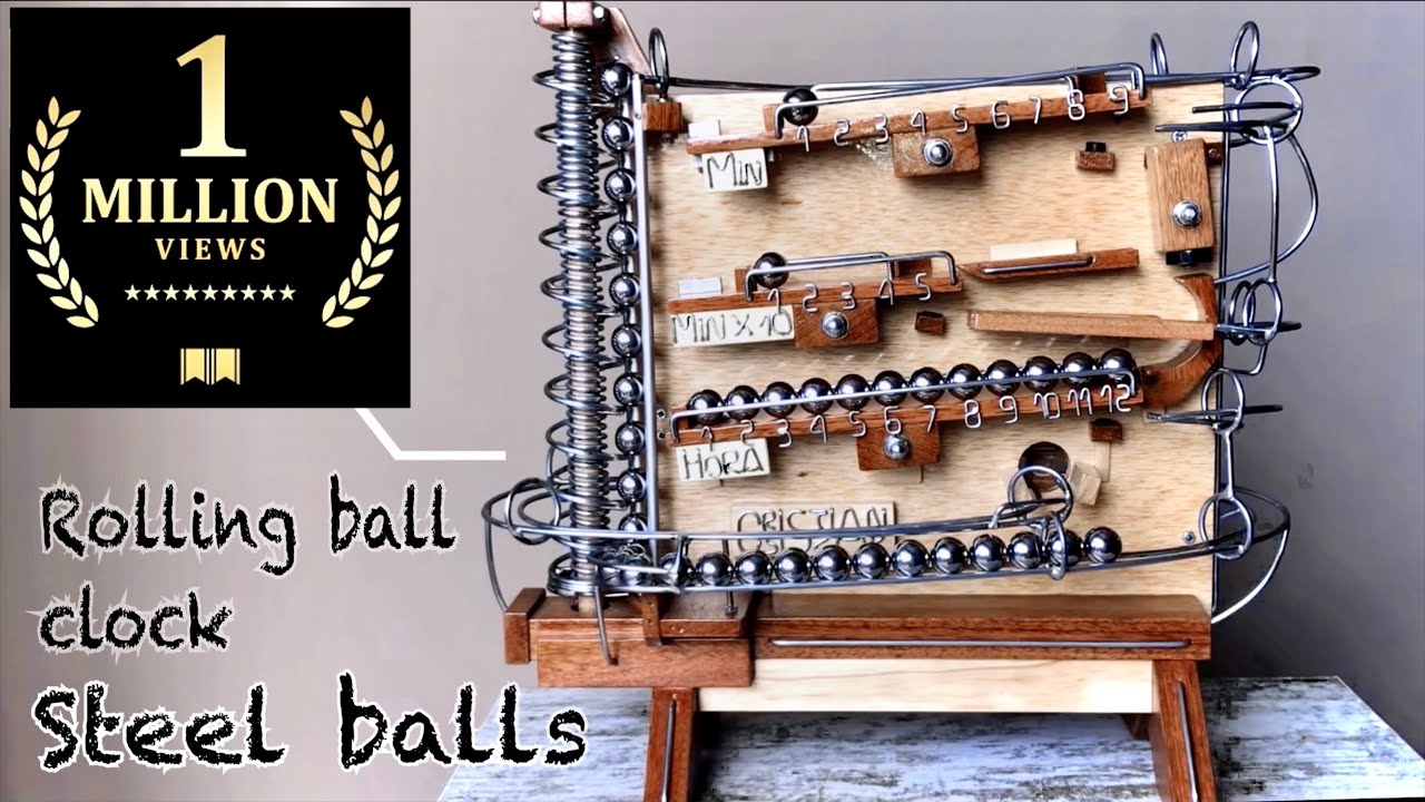 Un reloj artesanal de bolas de acero fabricado en madera | Microsiervos
