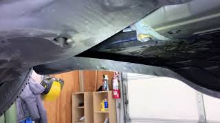 Tesla Model 3 under tray cleaning to remove road debris to prevent the panel from breaking off