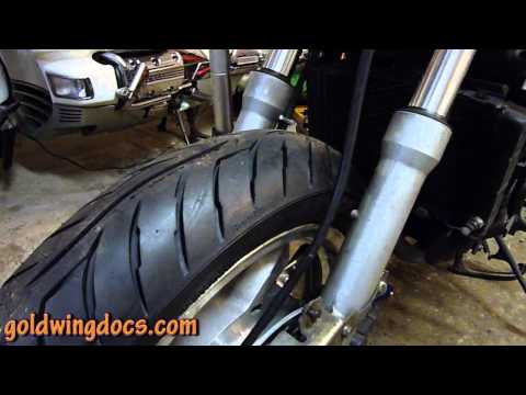 Part of a video titled Diagnosing and detecting worn or loose steering head bearings