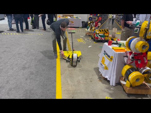 New Mighty Liner Bot Prototype Video Demo at Promat Show. Mighty Liner floor tape applicator robot.