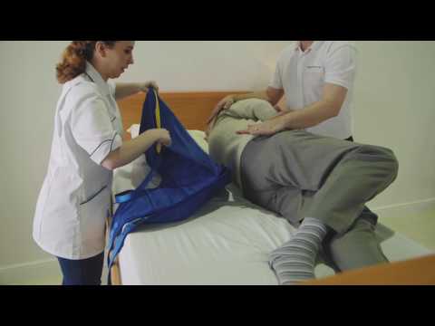Transferring from a bed to a chair featuring the Application of a Universal Sling and A 150F Folding