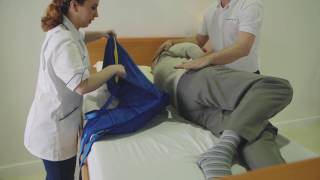Transferring from a bed to a chair featuring the Application of a Universal Sling and A 150F Folding