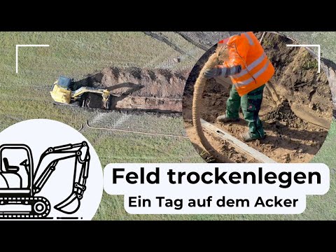 Draining a field: Laying a drainage pipe on a farm