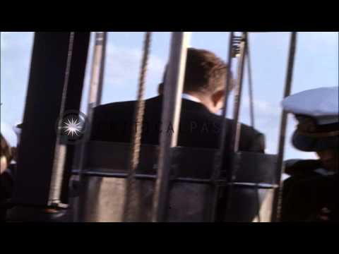 USS Northampton at dock, and John F Kennedy with others boards USS Thomas A Ediso...HD Stock Footage