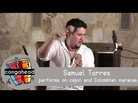 Samuel Torres performs on cajon and Colombian maracas