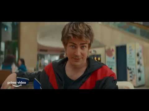 My Best Friend's Exorcism official trailer frame with Abby and Gretchen in 1980s high school hallway