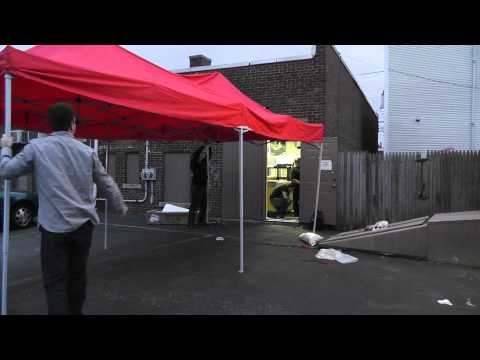 Setting Up A Red Tent At Redscroll Records