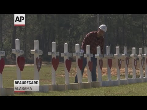 Greg Zanis is paying tribute to the 23 victims of Alabama tornado in his own way, he built 23 crosses for each victim and placed them in front of Providence Baptist Church. (March 6)
