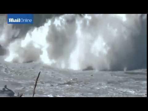 British surfer Andrew Cotton wipes out...