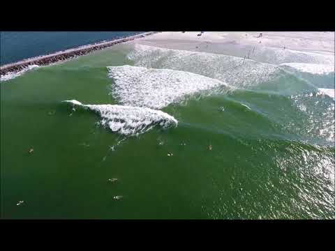 Drone footage of Ponce Inlet and surfers