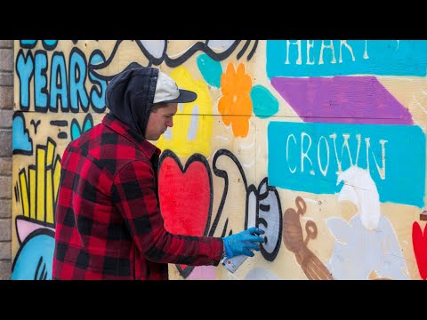 Muralist Robbie Lariviere paints the Byward Market