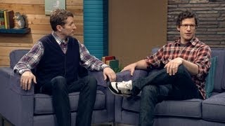 Andy Samberg Wears a Plaid Shirt and Glasses