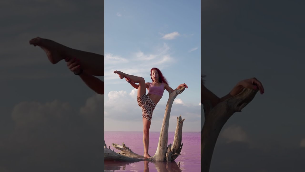 Beautiful Slim Woman Raises Leg in Splits Backdrop Stunning Pink Salt Lake