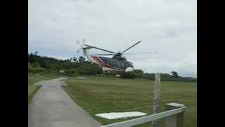 Passenger helicopter taking off from Tresco, Isles of Scilly