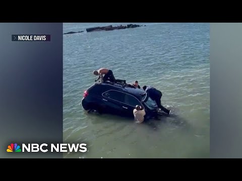 Dramatic rescue after woman drives car into frigid water