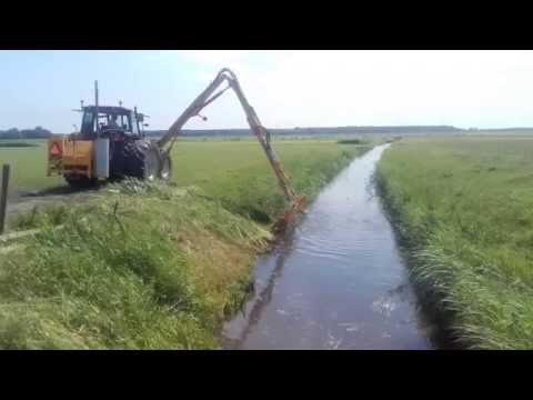 herder grenadier met 5,5 m. maaikorf op new holland m135