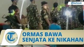 Viral Video Anggota Ormas Berbaju Loreng Bawa Senjata Laras Panjang ke Kondangan, Warganet; Ngeri!
