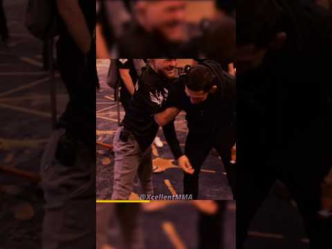 Petr Yan wrestling with Khamzat Chimaev
